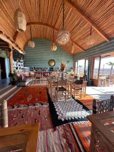 a large living room with a table and chairs at Agafay Valley in Marrakesh