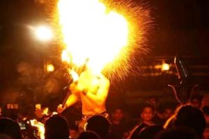 a man with a fire show at a concert at Arobab desert safaris in Ajman 