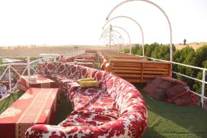 a row of couches sitting on top of a ship at Arobab desert safaris in Ajman 