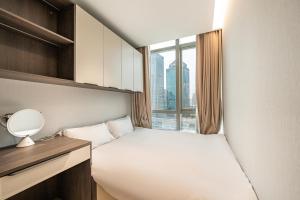 Postel nebo postele na pokoji v ubytování Today Aparthotel West Lujiazui Shanghai