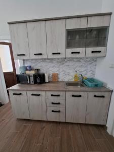 Η κουζίνα ή μικρή κουζίνα στο Yasmine Apartment Ultracentral +10 φωτογραφίες