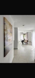 a living room with a large painting on the wall at 3 bedroom/ 3 bathroom villa, Sal, Cape Verde in Santa Maria
