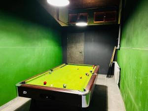 a room with a pool table with balls on it at Willa Zielony Świat in Międzybrodzie Bialskie