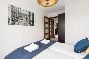 Posteľ alebo postele v izbe v ubytovaní Apartment Poznań Dąbrowskiego by Noclegi Renters