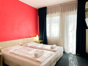 Postel nebo postele na pokoji v ubytování Hotel Bristol
