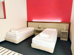Postel nebo postele na pokoji v ubytování Hotel Bristol