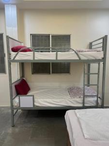 a couple of bunk beds in a room at Star STAY in Aurangabad