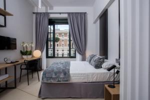 Ліжко або ліжка в номері Viminale View Hotel