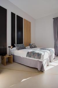 Ліжко або ліжка в номері Viminale View Hotel