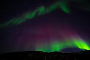 an image of the northern lights in the sky at 3ART recreation in Tromsø