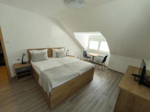 Voodi või voodid majutusasutuse Guesthouse Haler toas