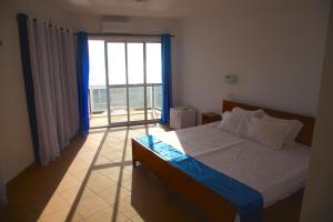 Letto o letti in una camera di Cacimba Sunset Lodge