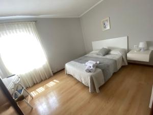 Posteľ alebo postele v izbe v ubytovaní Hotel Cais