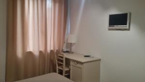 TV a/nebo společenská místnost v ubytování Hotel Ariston