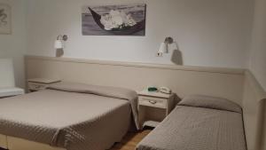 Postel nebo postele na pokoji v ubytování Hotel Ariston