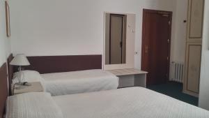 Postel nebo postele na pokoji v ubytování Hotel Ariston