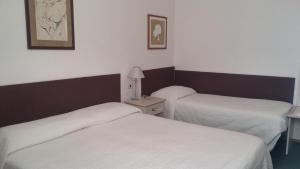 Postel nebo postele na pokoji v ubytování Hotel Ariston