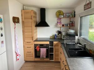 a kitchen with a sink and a stove top oven at St Marc proche plage, 2 chambres in Saint-Nazaire