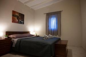 Ένα ή περισσότερα κρεβάτια σε δωμάτιο στο Green Yard House