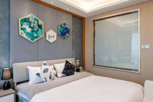 Postel nebo postele na pokoji v ubytování 柃居 B&B - Suzhou Center Apartment