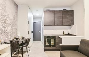 A kitchen or kitchenette at MyMozart Apartments Prague by Rentero Property