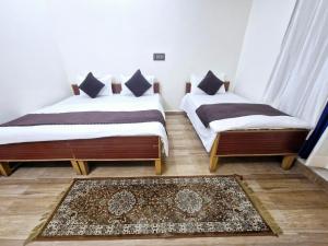 Postel nebo postele na pokoji v ubytování Hotel Aashirwad