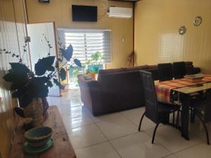 a living room with a couch and a table at Cabañas el Farolito in Puerto Montt