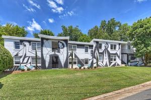 a house with a mural on the side of it at Comfortable and stylish condo near Myers Park in Charlotte
