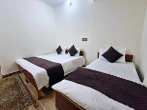Postel nebo postele na pokoji v ubytování Hotel Aashirwad