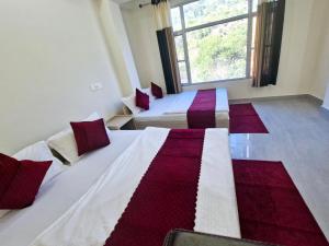 Postel nebo postele na pokoji v ubytování Hotel Aashirwad