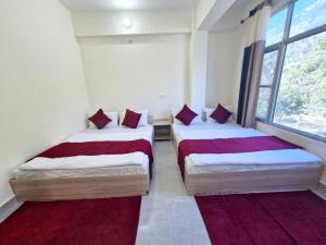 Postel nebo postele na pokoji v ubytování Hotel Aashirwad