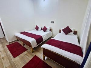 Postel nebo postele na pokoji v ubytování Hotel Aashirwad