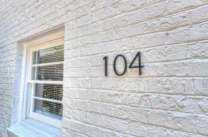 a building with the number on the side of it at Chic and Relaxing 1BR in the Heart of Myers Park in Charlotte