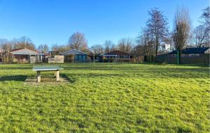 a picnic table in the middle of a field at Pet Friendly Home In Dirkshorn in Dirkshorn +16 photos