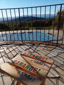 einen Balkon mit Poolblick in der Unterkunft Les Chardons Bleus in Saint-Laurent-sous-Coiron + 34 Fotos