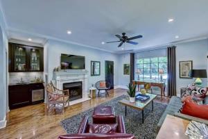 a living room with a couch and a fireplace at Elegant 2BR with Covered Patio in Charlotte
