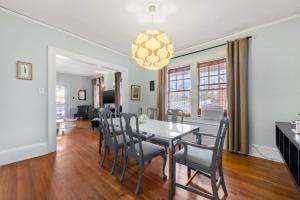 a dining room with a table and chairs at Well Located 1 BR in Elizabeth with Covered Porch in Charlotte