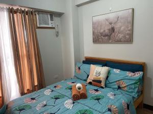 Uma cama ou camas num quarto em Verdon Parc Davao City with Balcony by darpm