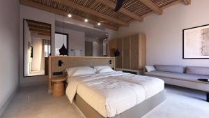 A bed or beds in a room at Paralos Irini Mare