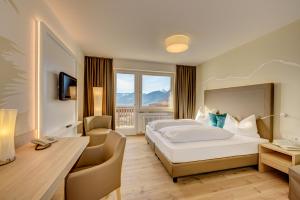 Postel nebo postele na pokoji v ubytování Garni Hotel Kessler