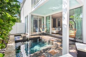 an indoor pool in the backyard of a house at Zen Villa in Key West