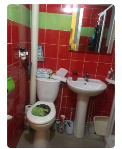 a bathroom with a toilet and a sink at Chez Miguel Angel in Bonneuil-sur-Marne +26 photos