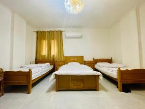 Postel nebo postele na pokoji v ubytování Jiamu House 嘉木旅居