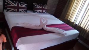 Voodi või voodid majutusasutuse The Pagodaa Resorts and Spa toas