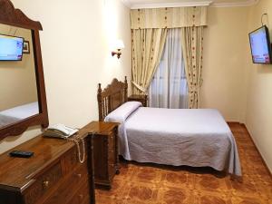 TV a/nebo společenská místnost v ubytování Hostal Bellido