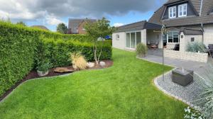 Κήπος έξω από το Ferienhaus Uggelharde mit großer Terrasse