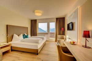 Postel nebo postele na pokoji v ubytování Garni Hotel Kessler