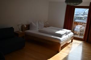 Postel nebo postele na pokoji v ubytování Ferienwohnung Allmein Top 2