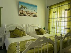 Postel nebo postele na pokoji v ubytování Dar Lola Djerba