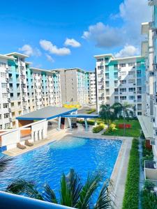 a swimming pool in the middle of some apartment buildings at Seawind Condo Tower 3,4,5,6 near Davao Airport in Davao City